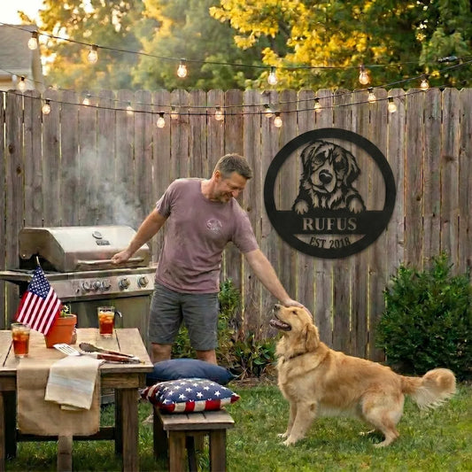 Man and dog in a backyard with a grill and decorative sign.